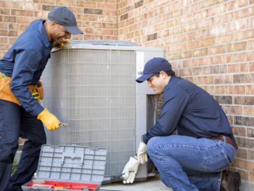 AC Maintenance being performed by Two HVAC Technicians in Oklahoma City, OK